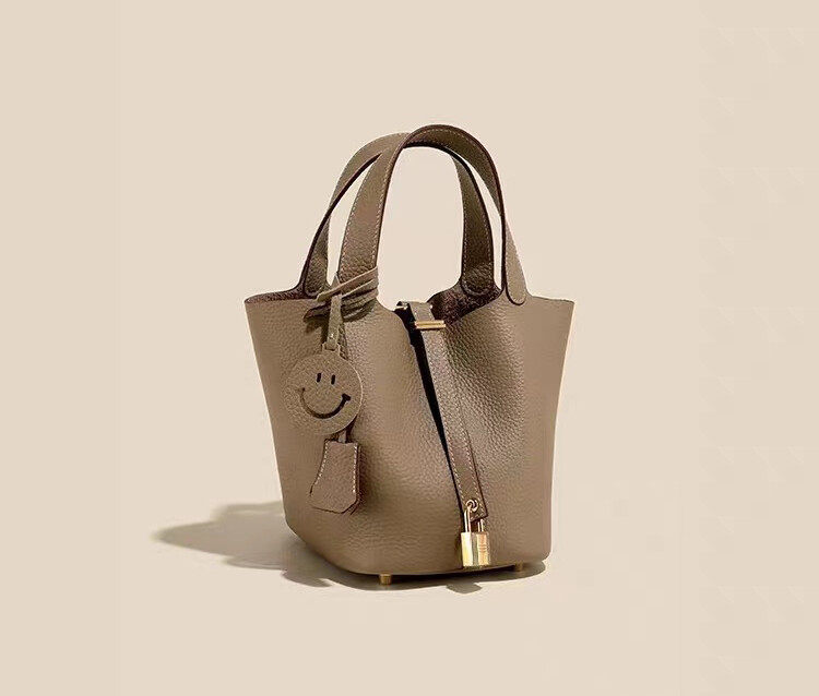 First layer of cowhide handbags with a smiling face
